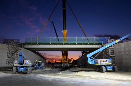 This is a photograph of the East Metropolitan project that used cranes to complete the works, specifically at night at times.
