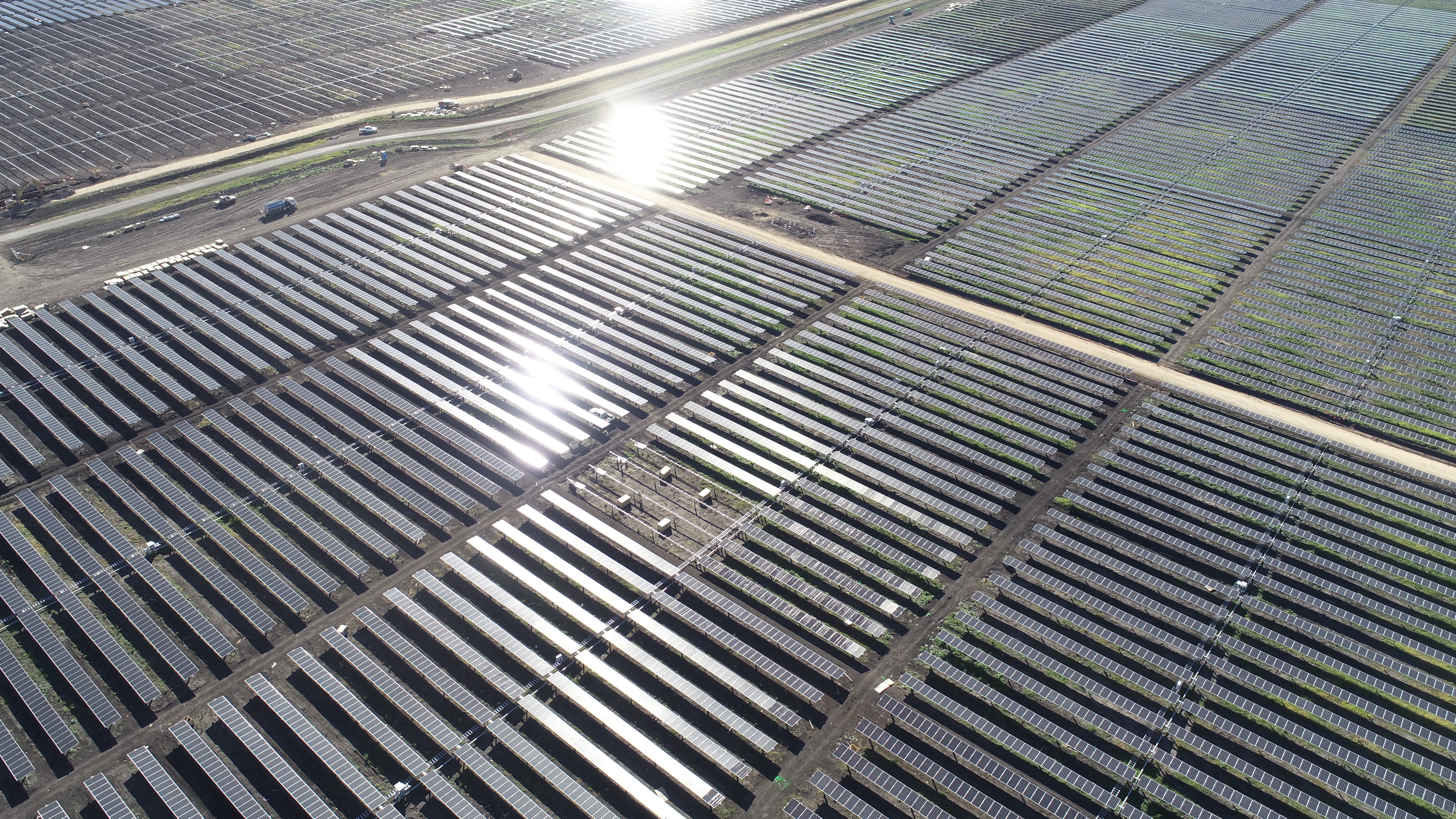 This is a high aerial shot of the Yarranlea Solar Farm showing the breakdown in blocks of the sections of panels and the service roads that are built around to acess them.
