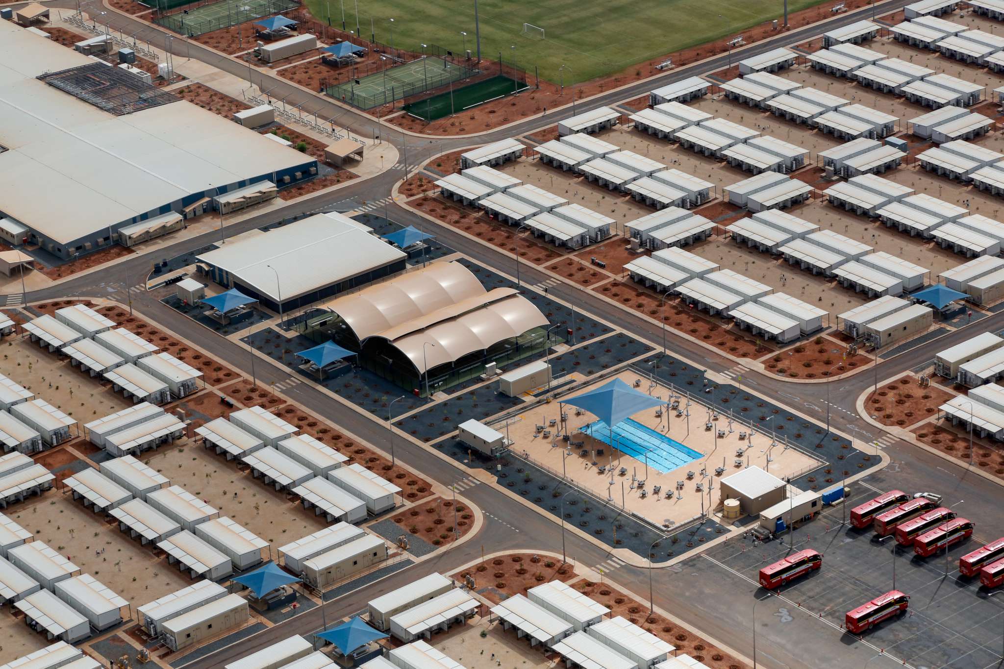 This is a photograph taken at Wheatstone Liquefied Natural Gas Plant showing the extensive facilities available to the workers including a swimming pool.