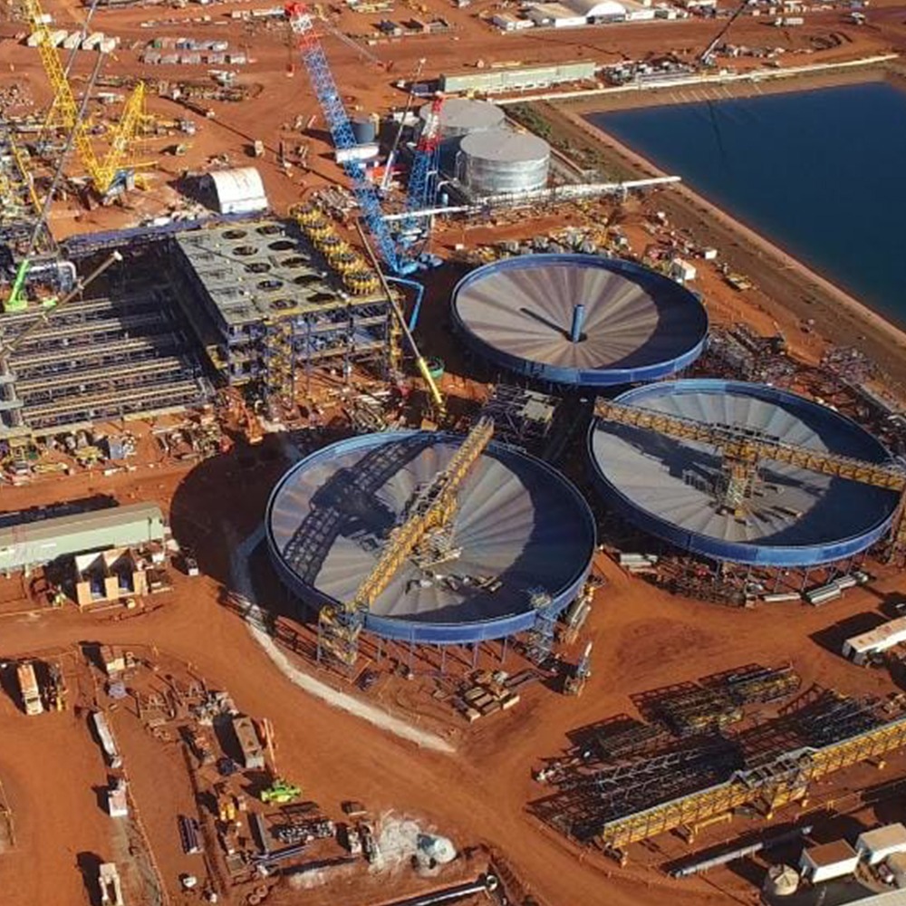 This photograph is of the Roy Hill major project Monford Group was a part of. It shows large tanks and cranes at work in the resource process.